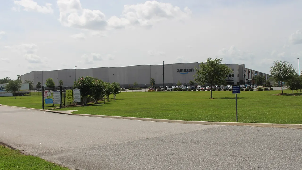 Exterior of an Amazon fulfilment centre in Ocala, Florida, with a parking area in front